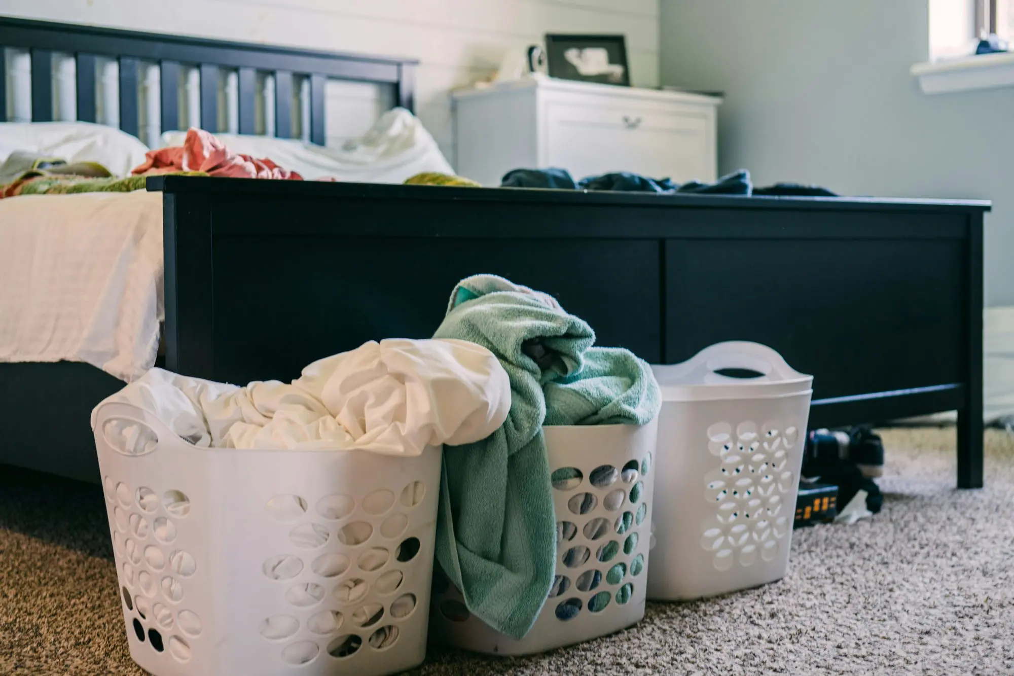 laundry in baskets waiting to be folded and stored
